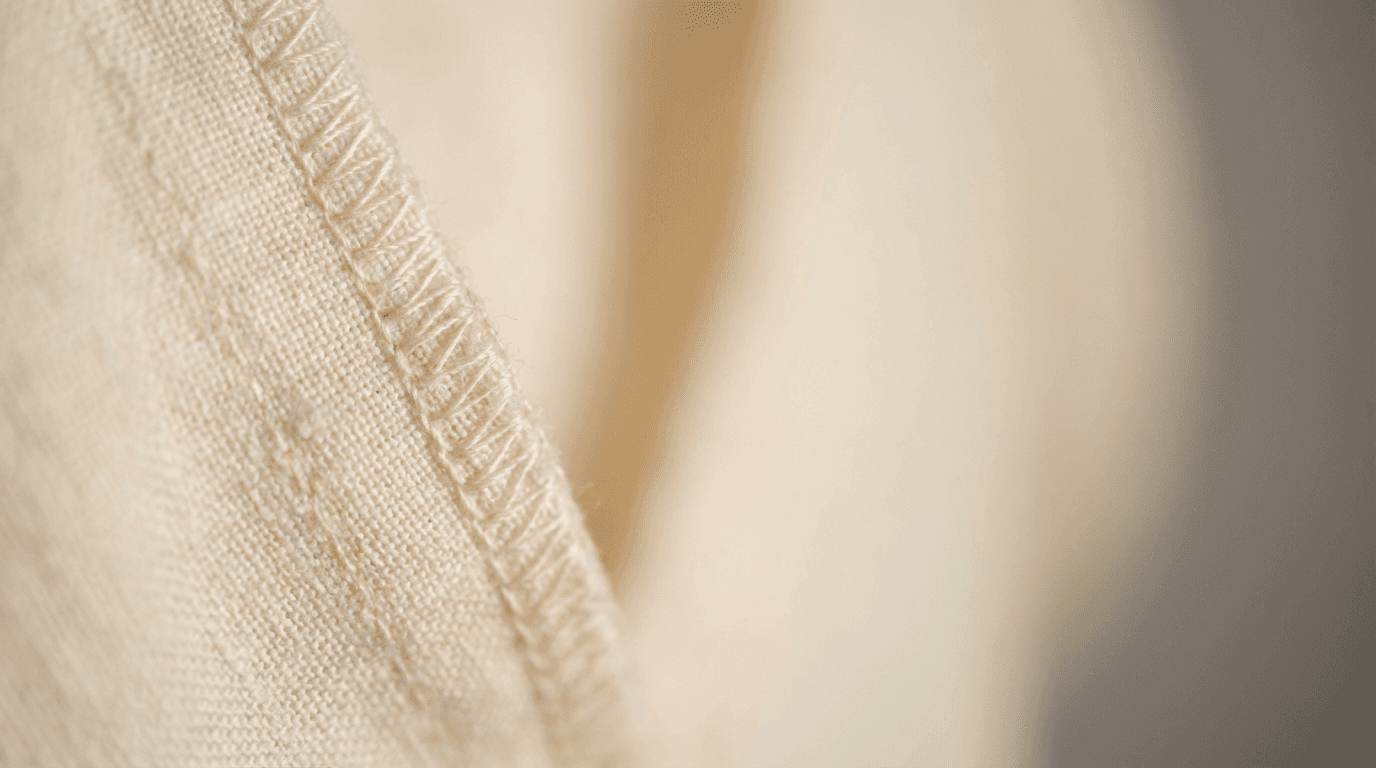 Hand inspecting seam on finished resortwear kaftan